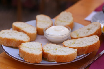 toast bread garlic aioli sauce close up photo with human hands