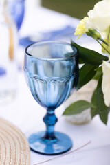 blue stem glass on dinner table