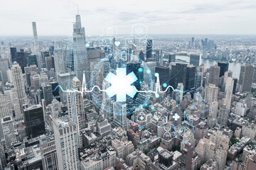 Aerial panoramic city view of Upper Manhattan, the East Side, river and Brooklyn on horizon, New York city, USA. Health care digital medicine hologram. The concept of treatment and disease prevention