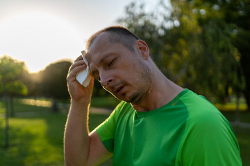 forehead sweat. Face of very sweating man. hot summertime season