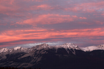 Fototapeta na wymiar Sunset over snowy mountains landscape