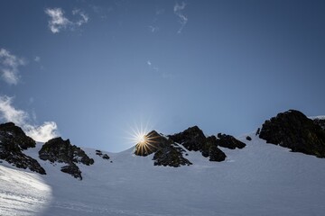 Sunburst over snowy mountain near lake Tahoe, California
