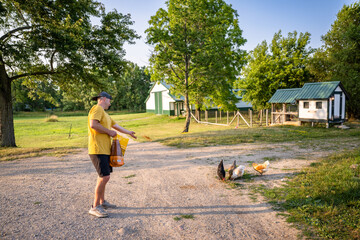 Marine veteran at home with family taking care of animals.