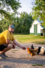 Marine veteran at home with family taking care of animals.