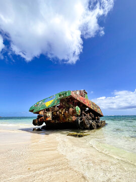 Graffiti covered rusty Sherman tank on the white sand of Flamenco Beach in Culebra Puerto Rico