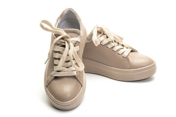 Pair of women's shoes in coffee color isolated on white background