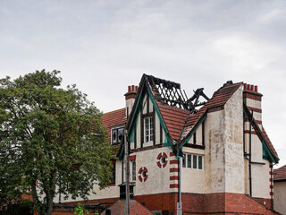 derelict building withdamaged roof.
