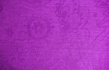 Background from decorative plaster with abstract patterns and stains. Fancy red and pink decoration wall texture, creative purple surface background. Finishing coating for building cladding.