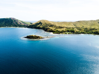 Island in Tropical Waters - Drone