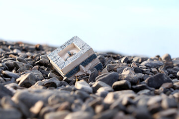 A box on a marine theme, stands on a rocky shore