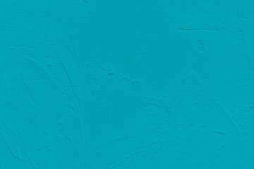 Saturated mint blue colored low contrast Concrete textured background. Empty colourful wall texture with copy space for text overlay and mockups. 2023, 2024 color trend