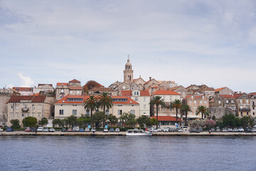 Obraz premium Beautiful old historic city Korcula on the island Korcula in south dalmatia region in Croatia. Picture taken during the cloudy summer day from the sea. Place to spend summer vacation in south Europe.