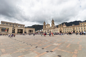 Bogota colombia main square knowed as Bolivar Square with Justice palace building and primatial cathedral at background  in sunny day  - obrazy, fototapety, plakaty