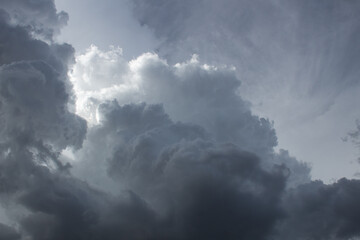 Obraz premium Dramatic dark and moody monsoon clouds in the Sonoran Desert during the month of August, 2022. Beautiful multilayered heavenly cloudscapes. Pima County, Tucson, Arizona, USA.