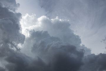 Obraz premium Dramatic dark and moody monsoon clouds in the Sonoran Desert during the month of August, 2022. Beautiful multilayered heavenly cloudscapes. Pima County, Tucson, Arizona, USA.