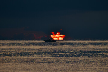 boat on the sea with sunset