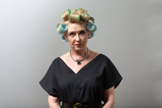 Elderly Old Aged Woman Housewife With Curlers Rollers On Hair Head.