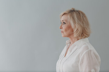 Elderly caucasian old aged woman profile portrait gray haired portrait