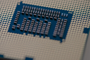 Close-up of a CPU golden pads. Shallow depth of field