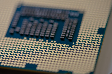 Close-up of a CPU golden pads. Shallow depth of field