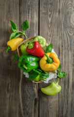 bell peppers and fresh basil, dill, parsley, cilantro, tomatoes, garlic, asparagus on a wooden table. top view. Flat lay