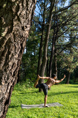 young man, doing yoga or reiki, in the forest very green vegetation, in mexico, guadalajara, bosque...