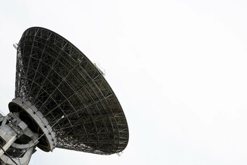 The silhouette of a satellite dish or radio antenna. Space observatory or air defense radar
