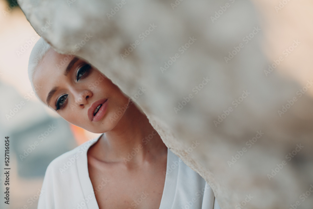 Wall mural portrait of young millenial european short haired woman. beautiful happy blonde girl outdoor. summer