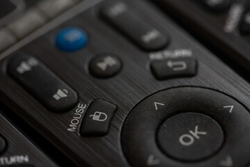 Close-up on a remote control sitting on a table