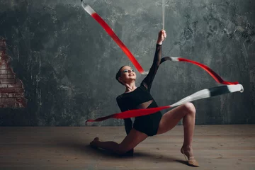 Foto op Plexiglas Young girl professional gymnast woman dance rhythmic gymnastics with ribbon at studio. © primipil