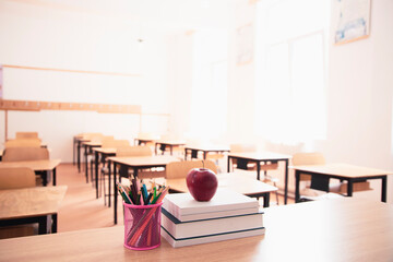 Pencils and books in the classroom. Education concept.