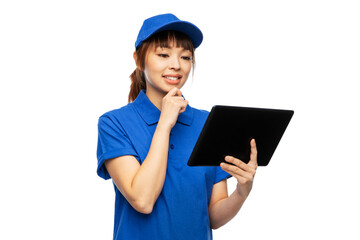 profession, job and people concept - happy smiling delivery woman in blue uniform with tablet pc computer over white background