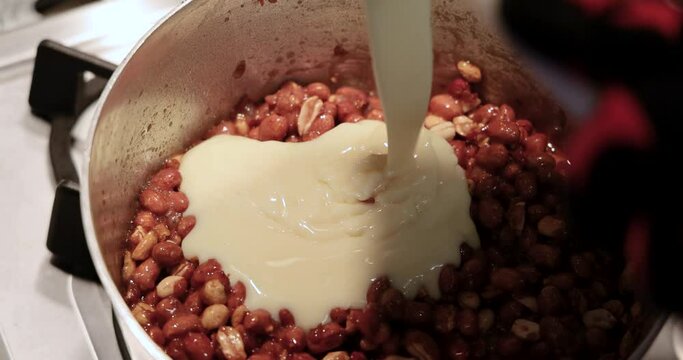 artisanal production of very traditional sweets in the region of Minas Gerais and Goiania made with peanuts, sugar and butter forming a plate that is then cut into cubes