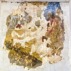 frescoes on the walls of an abandoned temple