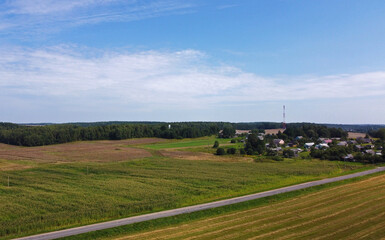 Naklejka premium Aerial view of a suburban road. Landscape forest and fields