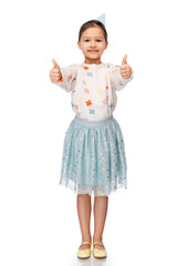 birthday, childhood and people concept - portrait of smiling little girl in party hat showing thumbs up over white background