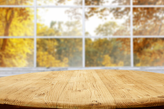 Desk of free space and autumn window 