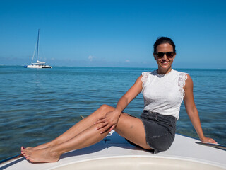 Fototapeta premium Beautiful woman on a boat trip in Mauritius
