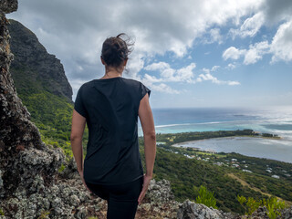 Female hiker in mauritius with coastal view