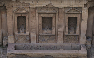 Ancient stone wall with large windows 