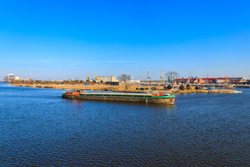 Barge sailing on the Oder river in Szczecin, Poland