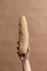 Hand holding a loofah, ecological vegetable sponge. Sustainable lifestyle