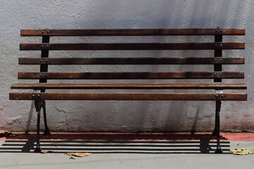 wooden bench on a street