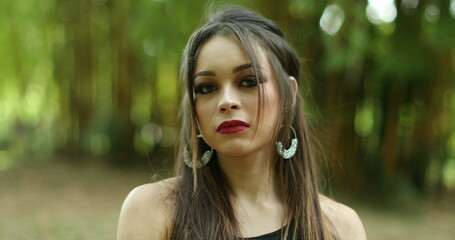 Serious defensive girl holding her hand in objection, saying NO. Young woman rejecting with finger