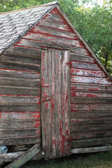 Rustic farm building with chippy paint red and gray