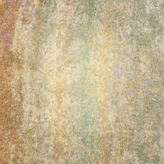 pastel colored orange yellow and green grainy wall texture or background