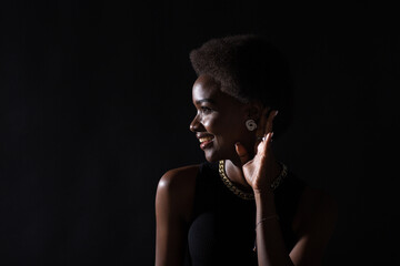 African American woman paying attention listening and holds hand on ear. Rumors, gossip,secrets and...