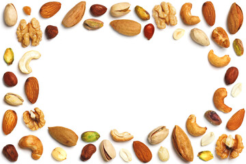 Various nuts isolated on white background. Pecan, macadamia, Brazil nuts, walnuts, almonds, hazelnuts, pistachios, cashews, peanuts, pine nuts. Top view or flat. Сopy space