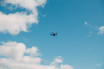 Big quadcopter drone on aerial flight and filming.