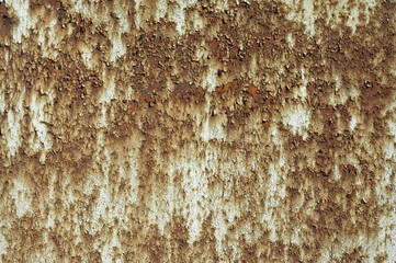 a rusty wall, in the photo a metal wall covered with rust and old paint